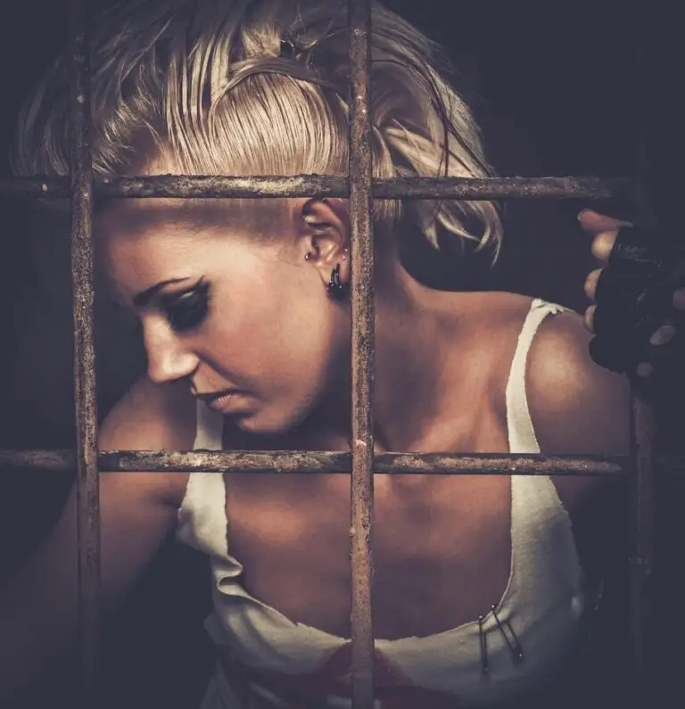 a woman behind steel bars or rebar