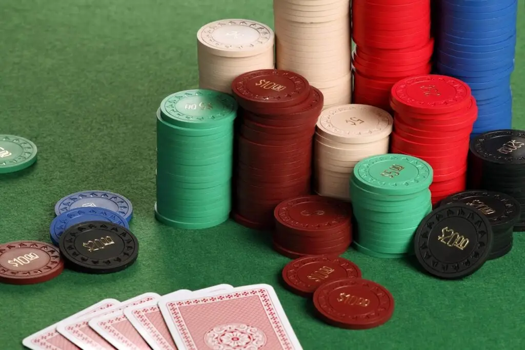 poker chips on a table and cards