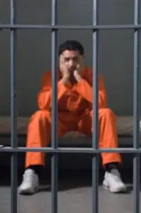 man in jail cell