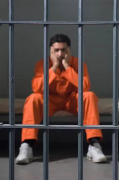 man in jail cell
